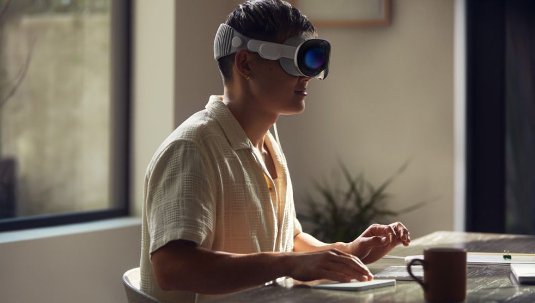 a person wearing virtual reality goggles apple vision pro